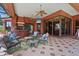 Spacious outdoor living area features a covered patio, built-in grill, and comfortable seating, creating an inviting space at 7580 Preservation Dr, Sarasota, FL 34241