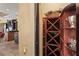 Walk-in wine cellar showcasing wooden racks to store wine bottles, offering an elegant way to store beverages at 7580 Preservation Dr, Sarasota, FL 34241