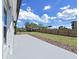 Spacious backyard featuring a patio, wooden fence, and healthy lawn at 7797 Barry Ct, Seminole, FL 33772