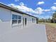 Back of house featuring a patio, multiple windows, and backyard access at 7797 Barry Ct, Seminole, FL 33772