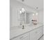 Bathroom featuring a large mirror, pendant lighting, and modern countertops at 7797 Barry Ct, Seminole, FL 33772