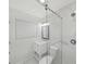 Modern bathroom featuring a glass shower door, window, and vanity at 7797 Barry Ct, Seminole, FL 33772