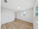 Bedroom featuring modern flooring and natural lighting at 7797 Barry Ct, Seminole, FL 33772