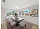 Dining room with large windows, modern flooring, and a view of the outdoors at 7797 Barry Ct, Seminole, FL 33772