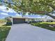 Charming single-story home with a well-manicured lawn and two-car garage at 7797 Barry Ct, Seminole, FL 33772