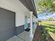 Home exterior featuring decorative front door columns and well-maintained landscaping at 7797 Barry Ct, Seminole, FL 33772