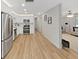 Modern kitchen seamlessly flows into the living area with stainless appliances at 7797 Barry Ct, Seminole, FL 33772