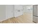 Stylish kitchen area featuring white cabinetry and stainless steel appliances at 7797 Barry Ct, Seminole, FL 33772