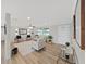 Bright living room with modern decor, light wood floors, and neutral color palette at 7797 Barry Ct, Seminole, FL 33772