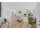 Spacious living room featuring hardwood floors, stylish furniture, and modern decor at 7797 Barry Ct, Seminole, FL 33772