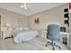 Bright bedroom featuring a shell patterned bed, natural light, and workspace at 808 3Rd W Ave # 214, Bradenton, FL 34205