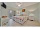 Well-lit bedroom with beach-themed decor, a ceiling fan, and access to an outdoor balcony at 808 3Rd W Ave # 214, Bradenton, FL 34205