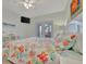 Cozy bedroom with beach-themed decor, a ceiling fan, and access to an outdoor balcony at 808 3Rd W Ave # 214, Bradenton, FL 34205