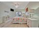 Beautiful bedroom with beach-themed decor, a ceiling fan, and access to an outdoor balcony at 808 3Rd W Ave # 214, Bradenton, FL 34205