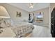 Bright bedroom featuring a shell patterned bed, natural light, and workspace with modern desk at 808 3Rd W Ave # 214, Bradenton, FL 34205