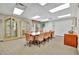 Spacious conference room with large table and comfortable chairs for meetings and gatherings at 808 3Rd W Ave # 214, Bradenton, FL 34205