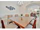 Dining room with light flooring and seating for six at 808 3Rd W Ave # 214, Bradenton, FL 34205