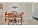 Dining room with light flooring and seating for six at 808 3Rd W Ave # 214, Bradenton, FL 34205