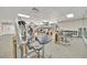 Fully equipped fitness center with weight machines, free weights, and mirrored walls at 808 3Rd W Ave # 214, Bradenton, FL 34205