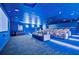 Luxurious home theater with plush seating, surround sound, and a large projection screen at 808 3Rd W Ave # 214, Bradenton, FL 34205