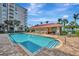 Relax by the sparkling community pool with a cabana, lounge chairs, and well manicured landscaping at 808 3Rd W Ave # 214, Bradenton, FL 34205