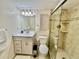 An updated bathroom has a stylish vanity and glass-enclosed shower, designed for comfort and functionality at 845 Benjamin Franklin Dr # 104, Sarasota, FL 34236