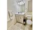 A cozy bathroom features a modern vanity, sink, and toilet, complete with fresh white towels at 845 Benjamin Franklin Dr # 104, Sarasota, FL 34236