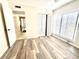 Bright bedroom with stylish flooring, closet space, and plenty of natural light at 845 Benjamin Franklin Dr # 104, Sarasota, FL 34236