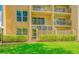 Inviting condo featuring manicured landscaping, private balconies and multiple windows for ample natural light at 845 Benjamin Franklin Dr # 104, Sarasota, FL 34236