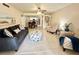 Open-concept living room with comfortable seating, stylish decor, and seamless flow to the kitchen at 845 Benjamin Franklin Dr # 104, Sarasota, FL 34236