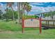 Welcome to Lido Key sign with lush greenery, blue sky, and tropical vibes at 845 Benjamin Franklin Dr # 104, Sarasota, FL 34236
