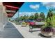 Charming street view showcasing local shops and lush landscaping in St. Armands Circle at 845 Benjamin Franklin Dr # 104, Sarasota, FL 34236
