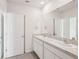 Spacious bathroom vanity featuring double sinks, a large mirror, and ample counter space at 8600 Milestone Dr, Sarasota, FL 34238