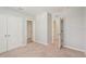 Light and airy bedroom with neutral colored carpet, fresh paint and doors at 8600 Milestone Dr, Sarasota, FL 34238