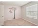 Bright bedroom with a pink accent wall, carpeted floors and a bright window at 8600 Milestone Dr, Sarasota, FL 34238