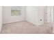 Bedroom with neutral carpet and a window to bring in natural light at 8600 Milestone Dr, Sarasota, FL 34238