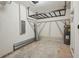 Spacious garage with shelving and updated electrical panel at 8600 Milestone Dr, Sarasota, FL 34238