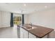 Kitchen island features granite countertops, stainless appliances and an open view to the backyard at 8600 Milestone Dr, Sarasota, FL 34238