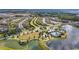 Aerial view showcasing the community layout with a pool, lakes, green spaces and residential areas at 9215 Royal River Cir, Parrish, FL 34219