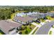 Drone shot showcasing the home with a pond in the background at 9215 Royal River Cir, Parrish, FL 34219
