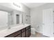 Bathroom featuring double sink vanity with dark wood cabinets and shower/tub combo at 9215 Royal River Cir, Parrish, FL 34219