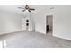 Large bedroom features neutral walls, carpeted floor, and adjoining bathroom and closet at 9215 Royal River Cir, Parrish, FL 34219