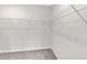 Walk-in closet featuring multiple shelves for optimal storage in this move-in ready home at 9215 Royal River Cir, Parrish, FL 34219