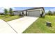 Charming one-story home with an attached two-car garage and well manicured lawn at 9215 Royal River Cir, Parrish, FL 34219
