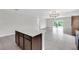Kitchen island overlooks living area and sliding glass doors at 9215 Royal River Cir, Parrish, FL 34219