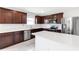 Kitchen features stainless appliances, modern counters and cherry cabinets at 9215 Royal River Cir, Parrish, FL 34219