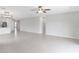 Bright living room features tile flooring and ceiling fan at 9215 Royal River Cir, Parrish, FL 34219