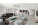 Open-concept living room flows into dining and kitchen areas, perfect for entertaining at 9215 Royal River Cir, Parrish, FL 34219