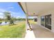 Covered patio with stunning views of the pond and landscaping at 9215 Royal River Cir, Parrish, FL 34219