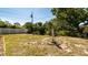 Spacious backyard with a statue in the garden offering a serene outdoor space and potential for landscaping at 923 Dawn St, Venice, FL 34285